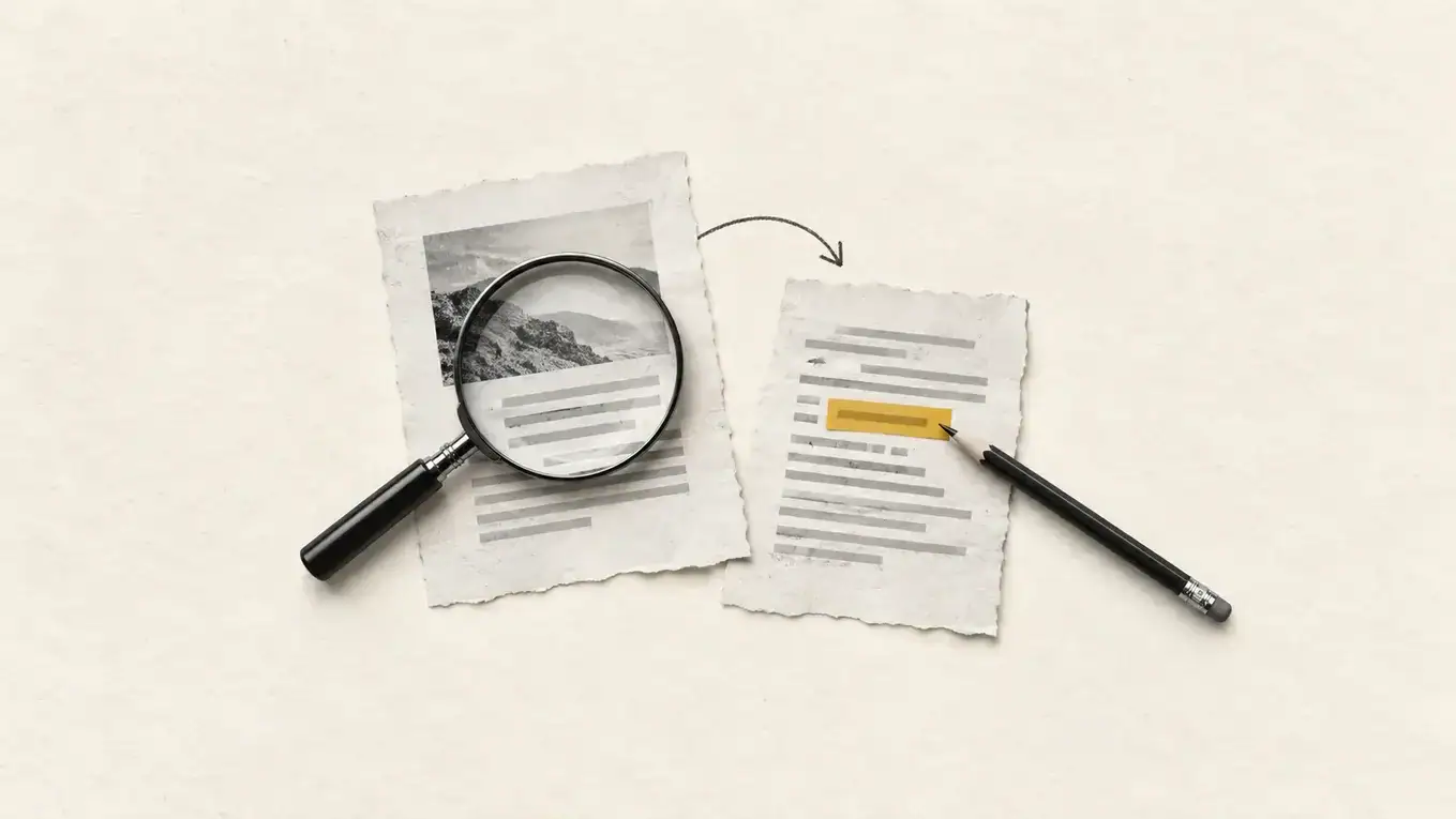 A magnifying glass examines a source page beside a pencil marking a second draft.