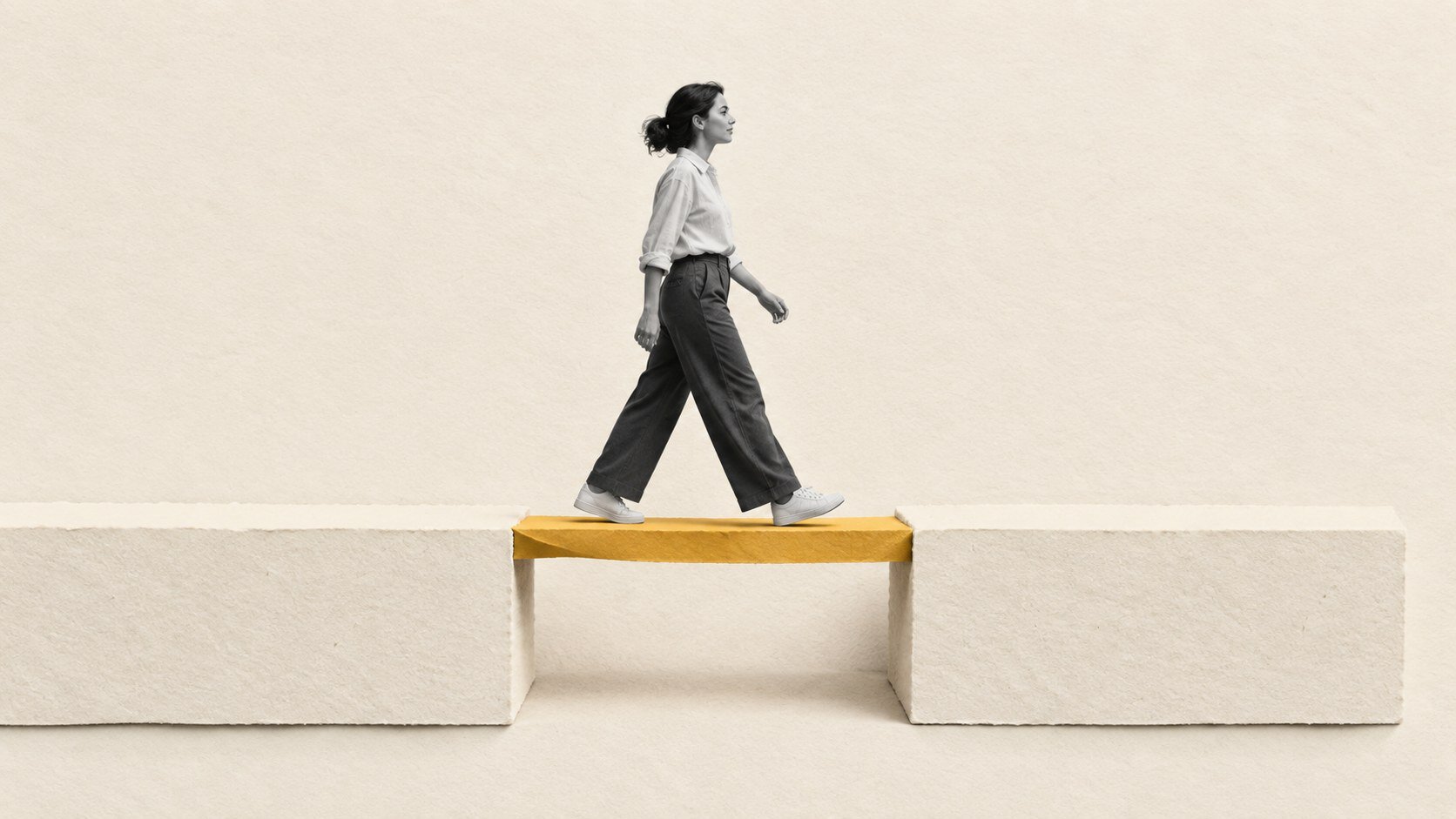 Mixed-media illustration of a person walking across a mustard paper bridge between two platforms of equal height