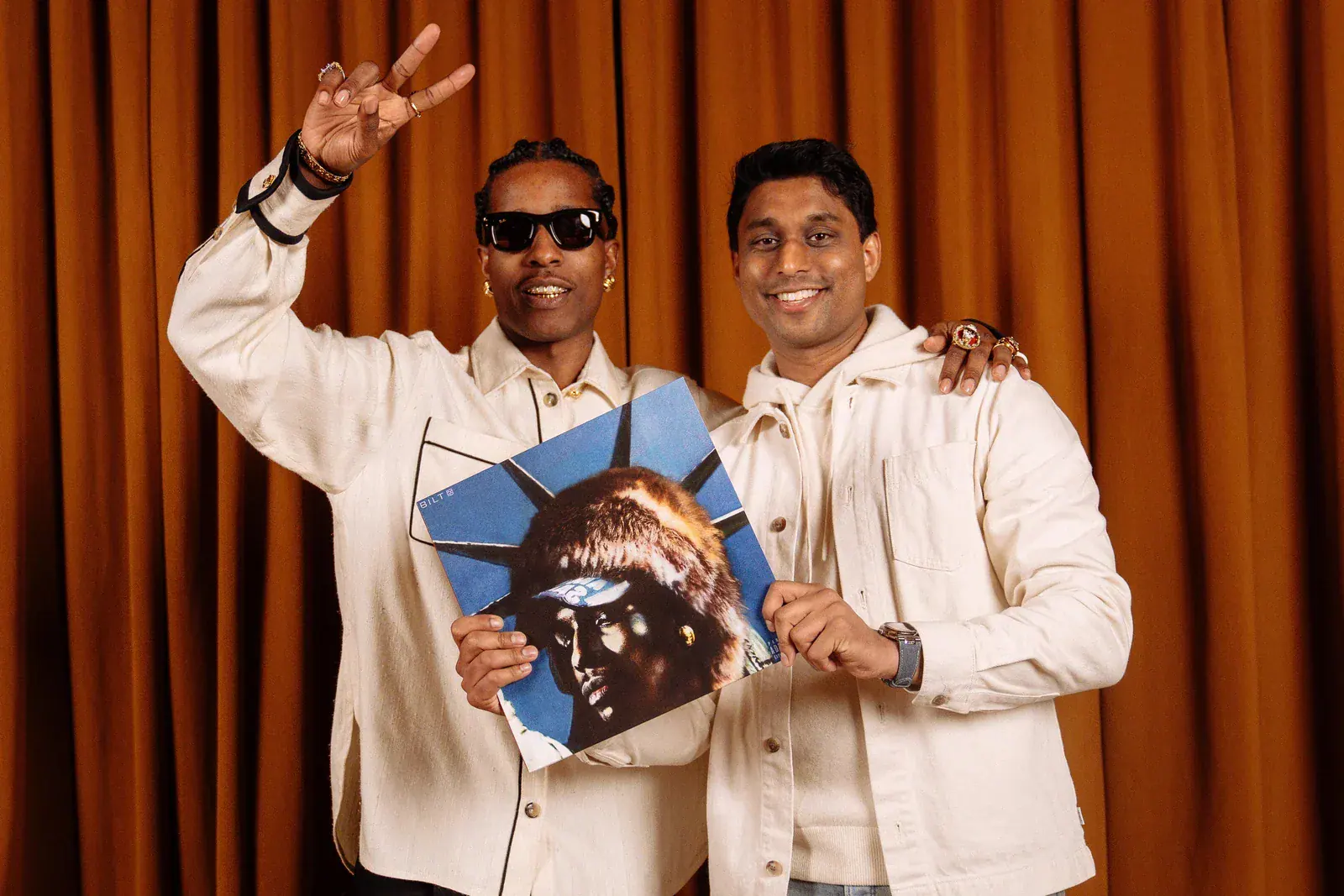 A$AP Rocky holding the Bilt-exclusive vinyl edition of Don't Be Dumb beside Bilt founder Ankur Jain.